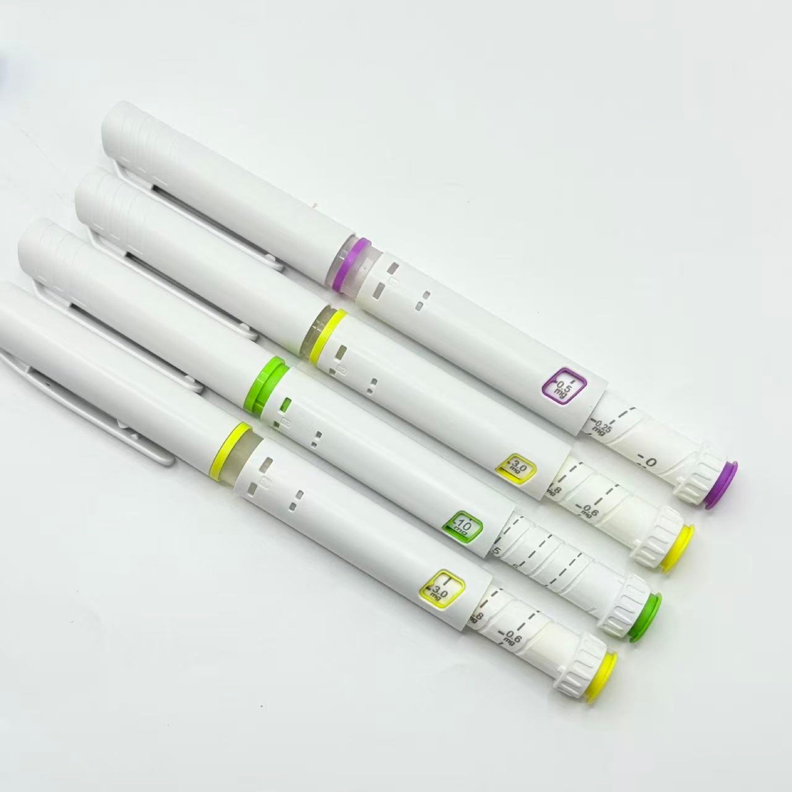 Pen injector samples with different printed dose scales