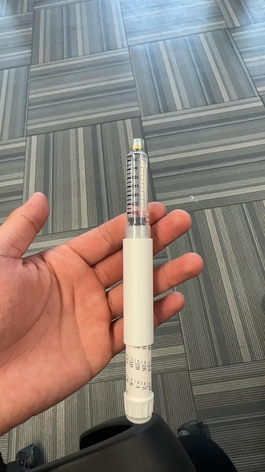 White pen injector sample opened to show its clear internal mechanism