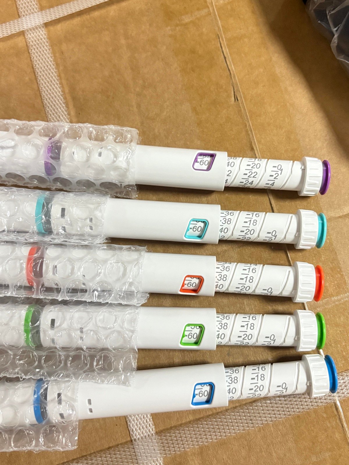 White pen injector samples with scale and color variants